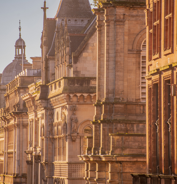 Series of building facades down Buchannan Street in the evening sunshine