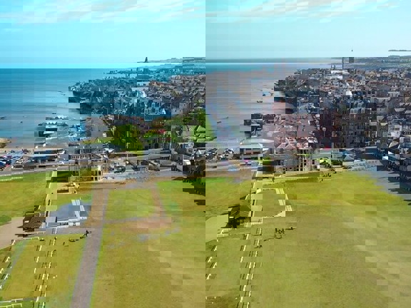 Ariel shot of Saint Andrews taking in the famous golf course and club house