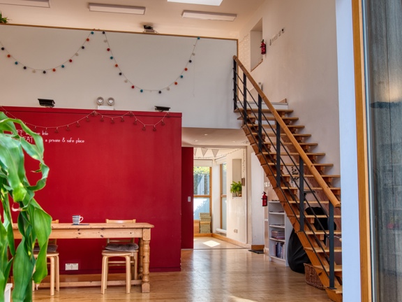 venue entrance with table and chairs and staircase