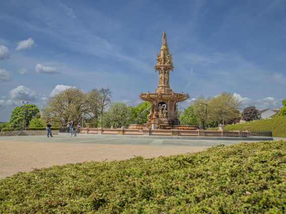 Sunny view of the large terracotta, five-tier, French Renaissance-style Doulton Fountain in Glasgow Green