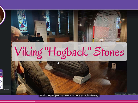 A screen shot of a virtual session. There is a picture of the inside of an old church housing coffin shaped stone items known as Hogback stones. These are thought to be from the Viking era. To the left of the screen shot is the Discover Glasgow business logo and a picture of the presenters face. Across the middle of the picture is reads 'Viking Hogback Stones'