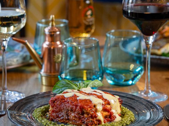 Restaurant table set with Italian food and wine