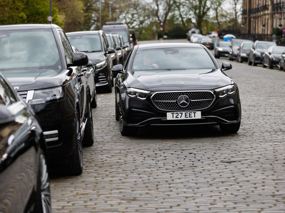 Black Mercedes car on a cobbled road
