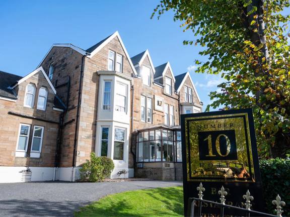 Victorian blond sandstone façade of Number 10 Hotel in Glasgow.