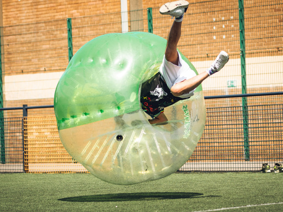 Person spinning around inside a giant inflatable ball. 