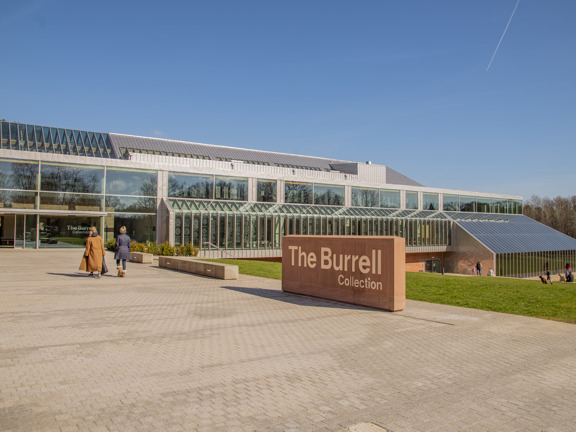 Two visitors entering glass structure of the The Burrell Collection