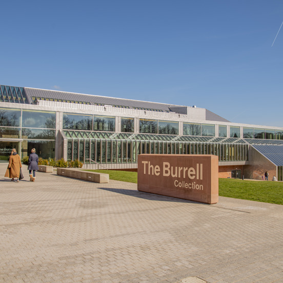 Two visitors entering glass structure of the The Burrell Collection