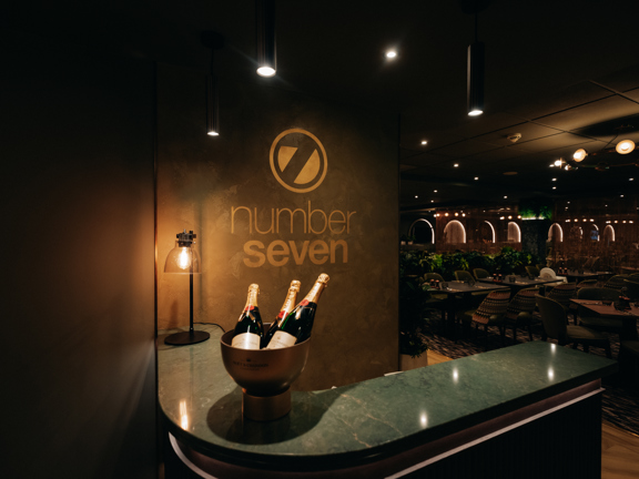 Number seven restaurant with bottles of champagne sitting in an ice bucket