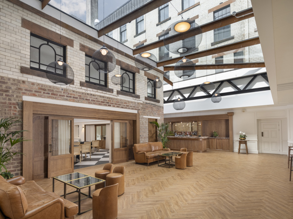 The Courtyard - oak parquet flooring, leather sofas and occasional seating, oak bar, double sliding doors leading through to a large event space.  to 