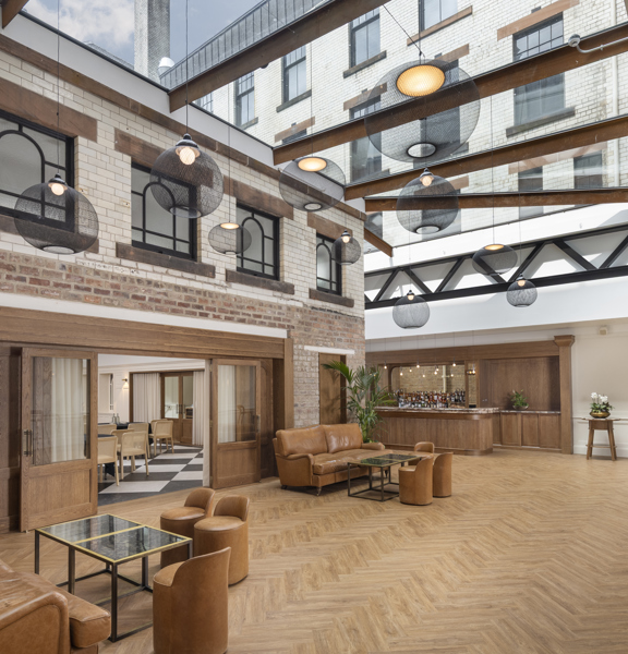 The Courtyard - oak parquet flooring, leather sofas and occasional seating, oak bar, double sliding doors leading through to a large event space.  to 
