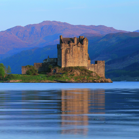 View of the ruins of Eilean Donnan castle across a loch