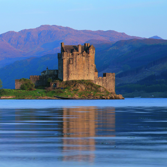 View of the ruins of Eilean Donnan castle across a loch