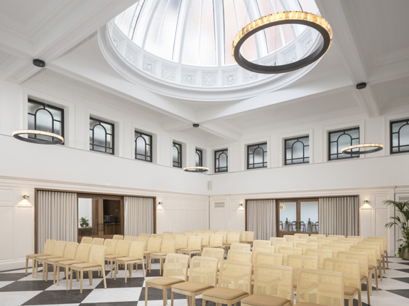 Theatre style meeting space - domed ceiling and checkerboard flooring. 