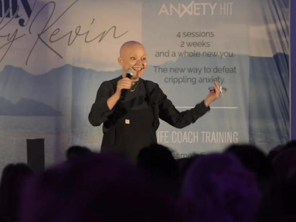 Speaker on stage at a conference