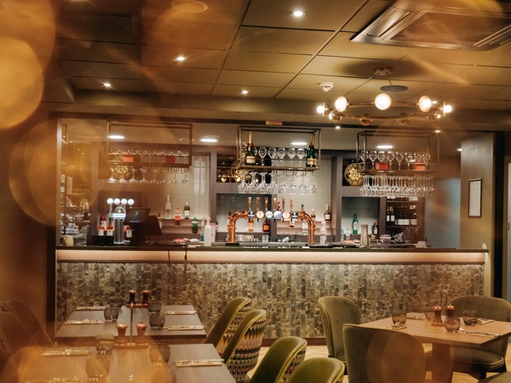 Bar area with dining tables and chairs.