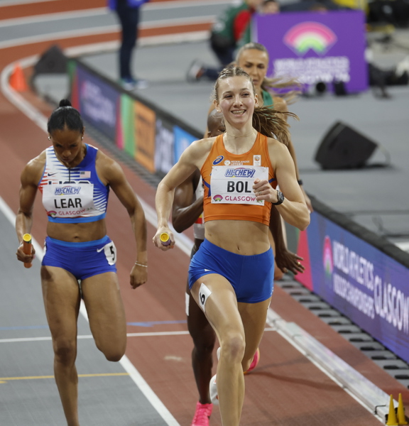A close up image of female athletes running round the track at Emirates during the World Athletics Indoor Championships