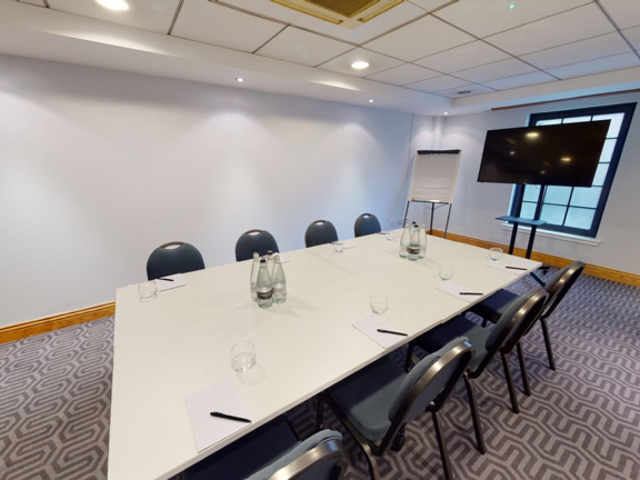 Small meeting room set up boardroom style