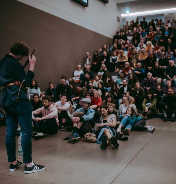 Large group of people in the Burrell Collection being photographed 