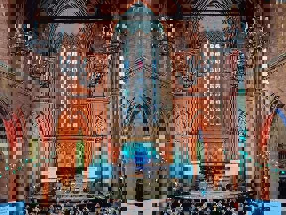 The Grand Hall at The Barony set up with table rounds for a dinner. 