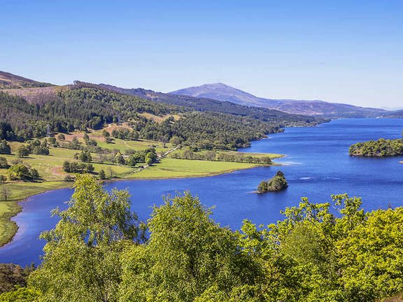 Rolling hills and loch in Scotland