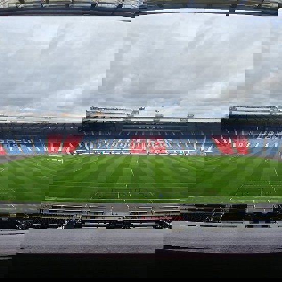 A view of Hampden stadium from the empty stands with the word HAMPDEN spelt out in the chairs in white