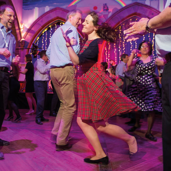 people laughing and ceilidh dancing