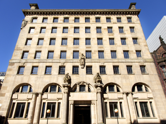 Exterior shot of 200 Conference & Events Ltd, a multi-storey sandstone building with large arched windows on the ground floor
