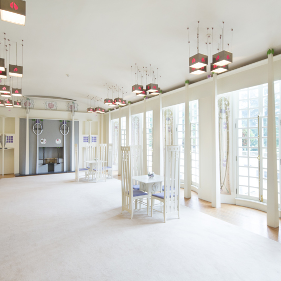 View of the Music Room in the House for an Art Lover, with art-nouveau chairs and chandeliers, with Charles Rennie Mackintosh motifs