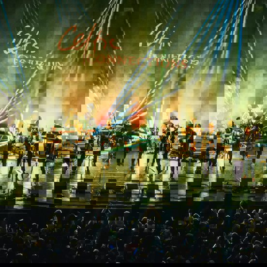 A band perform on stage, in front of a Celtic Connections sign.