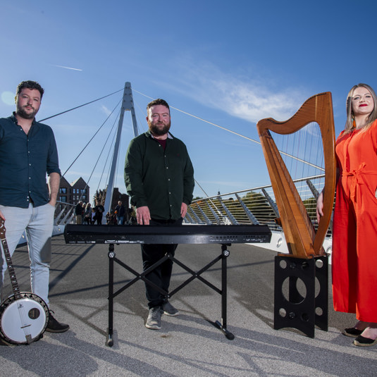 Celtic Connection Artists pose for a photo with instruments
