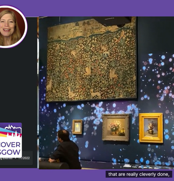 Screenshot of a virtual tours with a picture of the presenters head on the to left of the image. Disciver Glasgow Logo to hte bottom left and the main images is of the inside of The Burrell Collection (a museum in Glasgow) displaying some art. Captions along the bottom read: they are really cleverly done. 